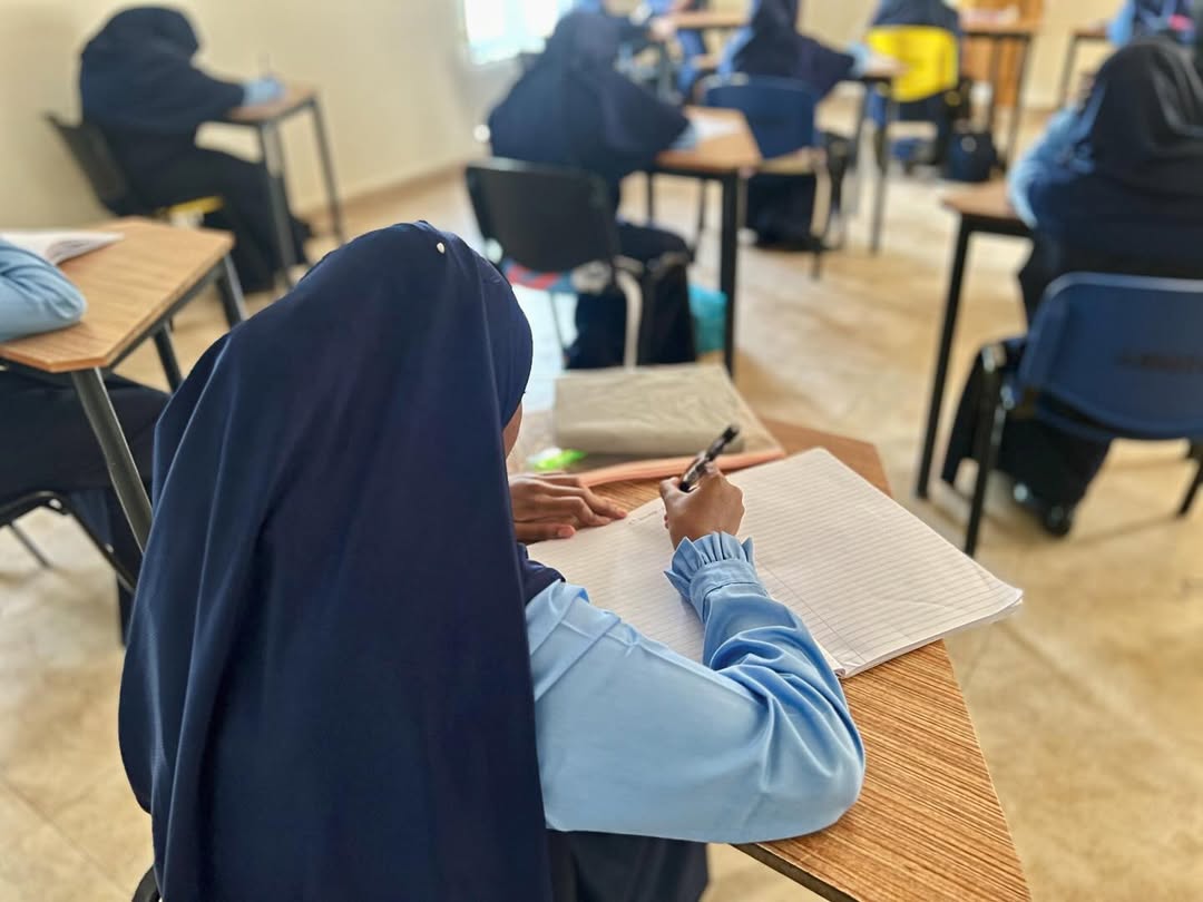Junior Student Writing in Class